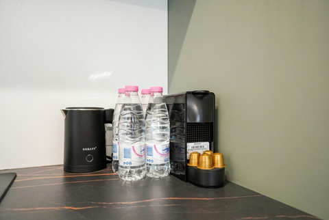 Convenient coffee and tea station with bottled water for guest comfort