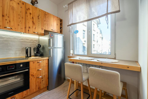 Kitchen with two high chairs and street view