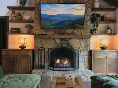 Living Room and Dining with deck access large windows and fireplace