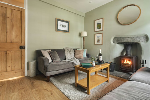Cosy lounge moments from town centre with log burner to relax after a day on the fells!

