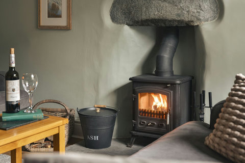 Traditional log burner to gather round after a day walking on the fells