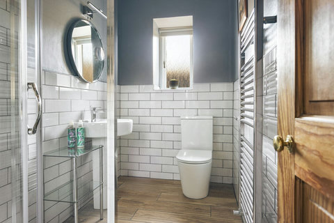 Two beautifully designed bathrooms, each with it's own walk in shower
