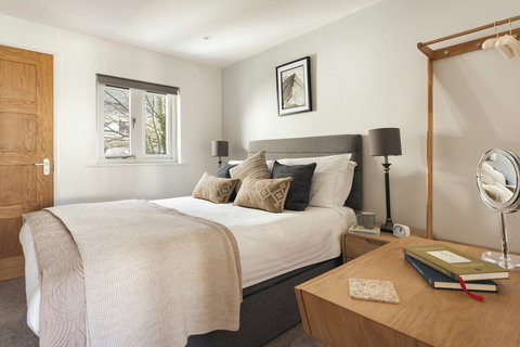 Bedroom with dressing table and new, luxury mattress 