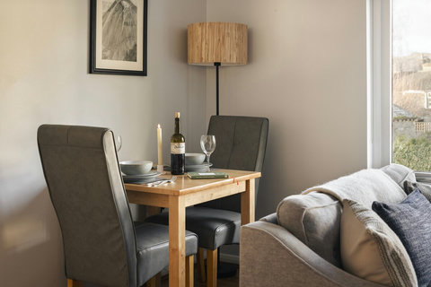 Cosy dining table with space to enjoy a home cooked meal (or takeaway!)