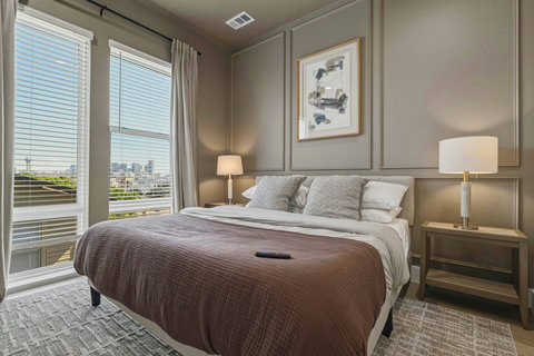 Retreat to a spacious master suite featuring a luxurious king‑size bed perfect for a restful night’s sleep. Enjoy your favorite shows on the wall‑mounted TV. This room offer comfort, relaxation, and a touch of indulgence during your stay.