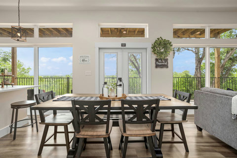 Bright dining with deck access and tranquil treetop views