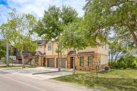 Charming stone townhouse with garages, shade trees, and quiet setting