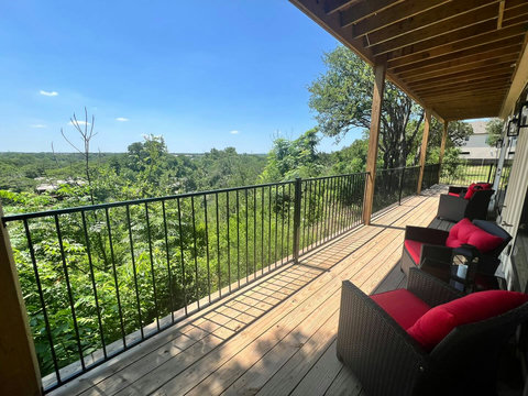 Spacious covered deck with sweeping treetop views & comfy seating