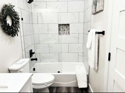 This modern guest bath is not only a place to freshen up, but a serene retreat where you can refresh.