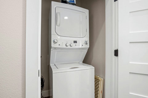 Stacked washer and dryer available for your laundry needs. We provide detergent to get you started.