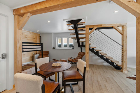 bunk beds and stairs down to lower living level. 