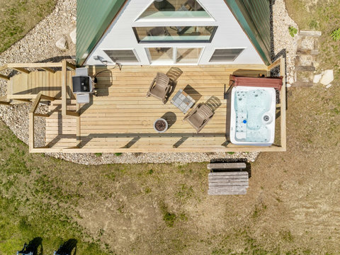 Hot tub, Picnic Table, yard and gas fireplace. 
