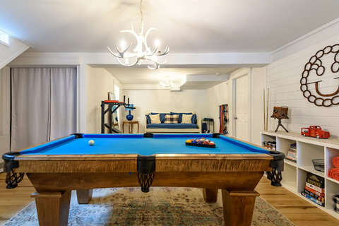Pool Table. Laundry area and workout space in the rear with a day bed. 