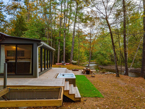 Hammock built into the deck next to the outdoor shower and hot tub. 