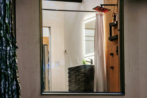 Super cool bathroom with a large picture window. 

