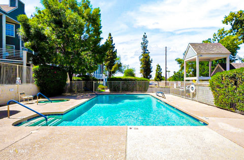 Sunny, fenced pool with spa and gazebo—your resort-style retreat