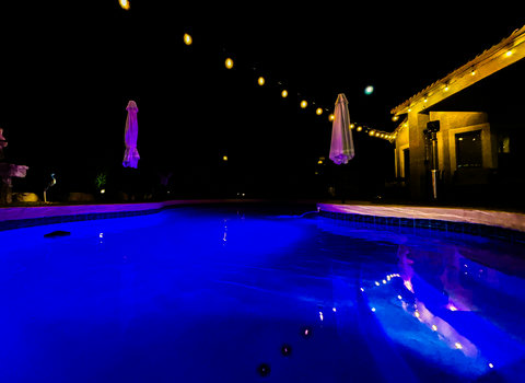 Glowing blue pool and twinkling patio lights for magical nights outdoors