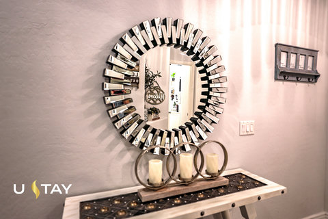 Welcoming entryway with statement mirror and stylish modern decor