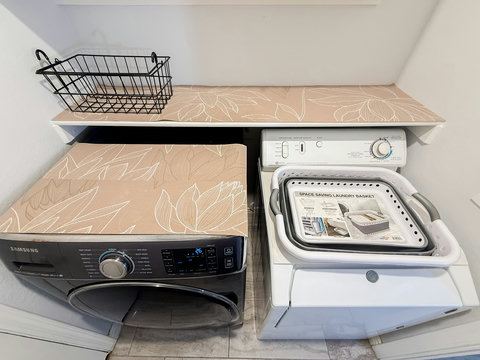 Convenient in-unit laundry with folding space and guest-friendly storage