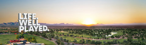 Panoramic sunset views over lush golf greens and mountain horizons