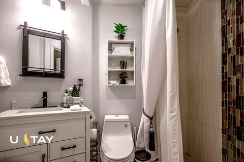 Modern bathroom with stylish vanity and walk-in shower