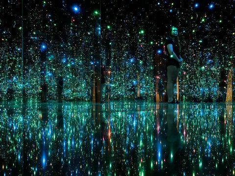 Mesmerizing infinity light room with mirrored walls and glowing ambiance