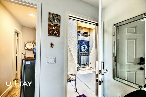 Bright entryway with mirror and charming private front patio