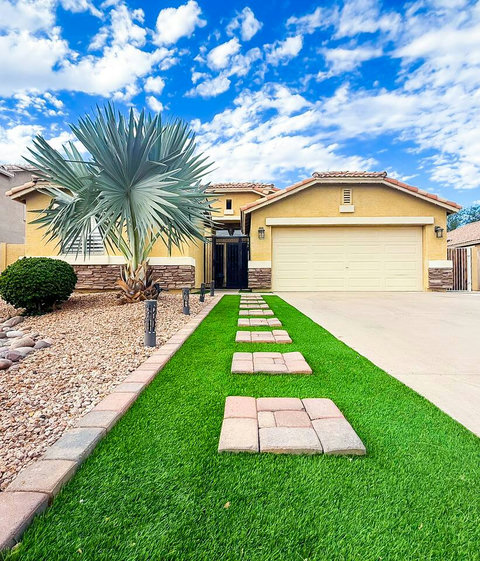 Inviting desert-style home with standout curb appeal and a spacious driveway