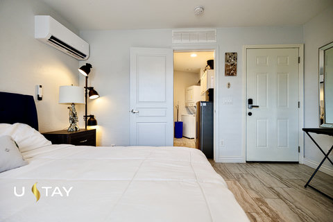 Bright bedroom with AC and convenient access to a private kitchenette