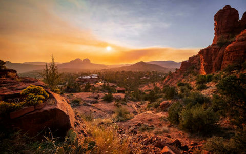 Breathtaking sunset views over iconic red rocks and desert landscape