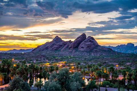 Spectacular sunset views over iconic desert peaks and palm-lined grounds