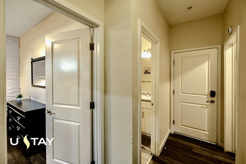 Bright modern hallway with easy access to bedroom and bathroom