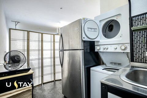 Convenient kitchenette with full-size fridge and in-unit washer/dryer