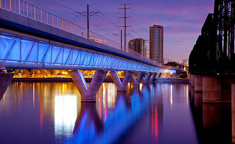 Stunning twilight bridge and skyline views reflected on the waterfront