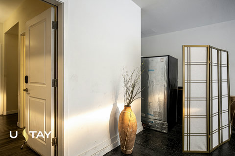 Bright hallway with stylish decor and flexible privacy screen