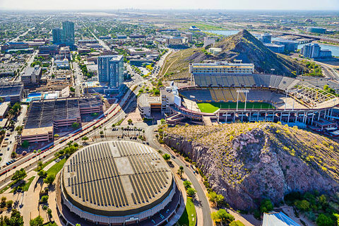 Epic aerial views near downtown, stadiums, and iconic desert hills