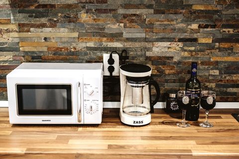 A coffee & tea maker plus a microwave
