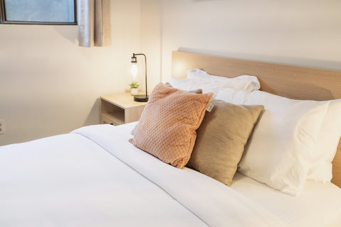 Clean, relaxing primary bedroom