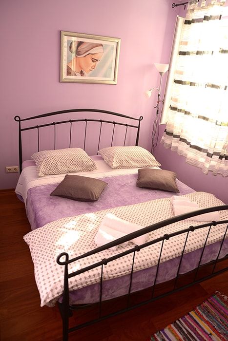 Bedroom with double bed and with big cabinet not seen on the picture. Looking west.