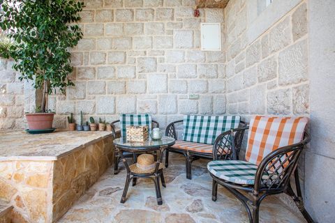 Relax in a cozy outdoor seating area, perfect for enjoying the fresh sea breeze and peaceful surroundings.