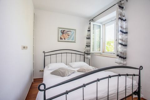 Cozy bedroom featuring a comfortable queen-size bed, perfect for restful nights and peaceful mornings.