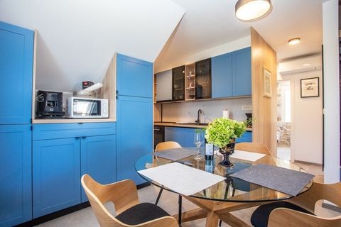 Contemporary kitchen with clean design and plenty of light, perfect for creating meals in comfort and style.