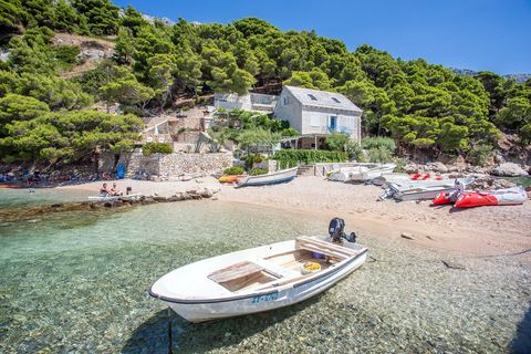 Serene coastal scene showcasing a pristine beach and sparkling Adriatic waters.