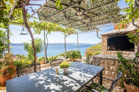 Elegant angle of the outdoor dining area, highlighting both the setting and breathtaking sea.