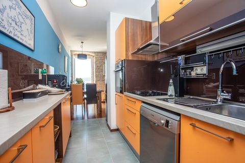 Bright and stylish kitchen overlooking the Adriatic, blending functionality with breathtaking coastal scenery.