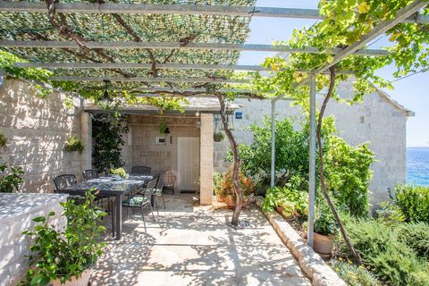Inviting garden and alfresco dining captured from a new perspective, with the serene sea as a backdrop.