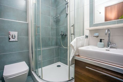 Chic and inviting bathroom with contemporary design, perfect for a relaxing start or end to the day.