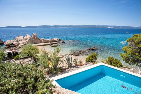 Stunning poolside scene overlooking the Adriatic, where luxury meets tranquil seaside beauty.