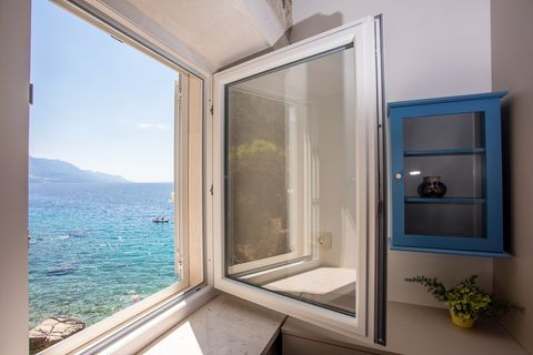 Wake up to breathtaking views from the bedroom, where the sparkling sea stretches to the horizon.