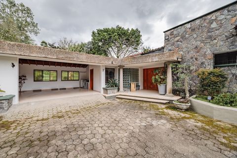 Front door, garage and parking lot with space for two cars in the garage and four cars in the parking lot.